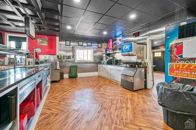 a room with furniture and gym equipment