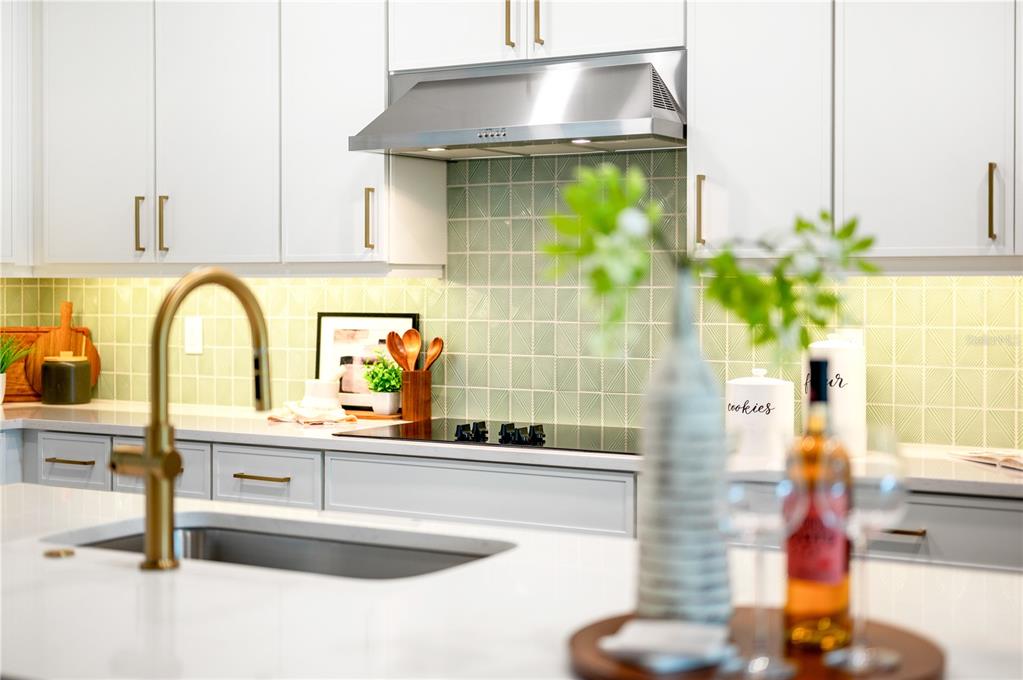 9992 Key Haven Road Seminole, FL 33777 - Photo 13 of 49 a kitchen with a sink and a potted plant