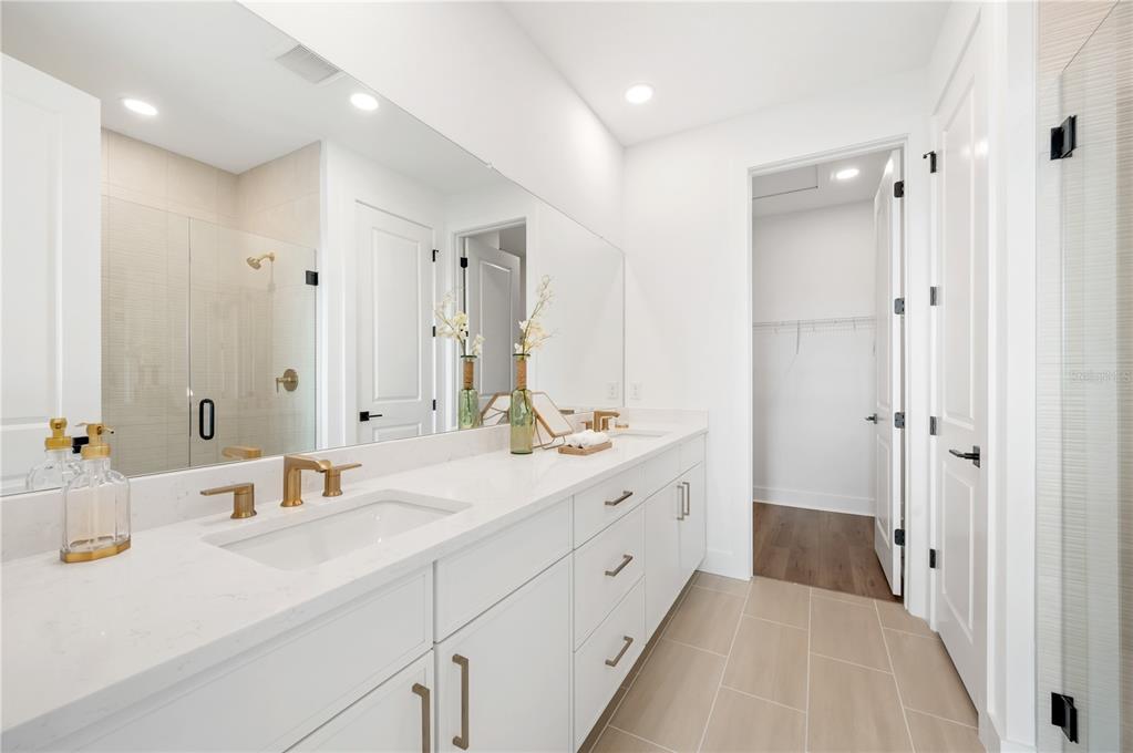 9992 Key Haven Road Seminole, FL 33777 - Photo 21 of 49 a en suite bathroom with double sink and a large mirror