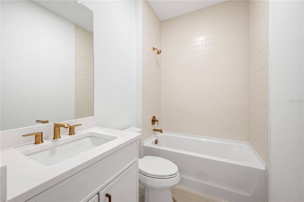 9992 Key Haven Road Seminole, FL 33777 - Photo 26 of 49 a bathroom with a sink a toilet and shower