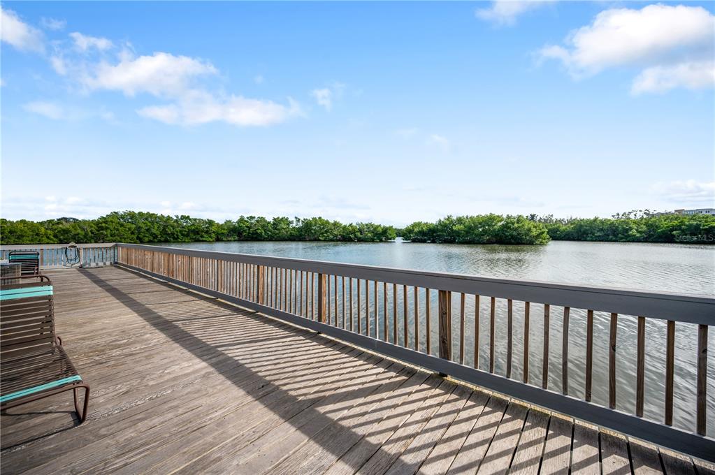 9992 Key Haven Road Seminole, FL 33777 - Photo 46 of 49 a view of balcony with wooden floor and fence