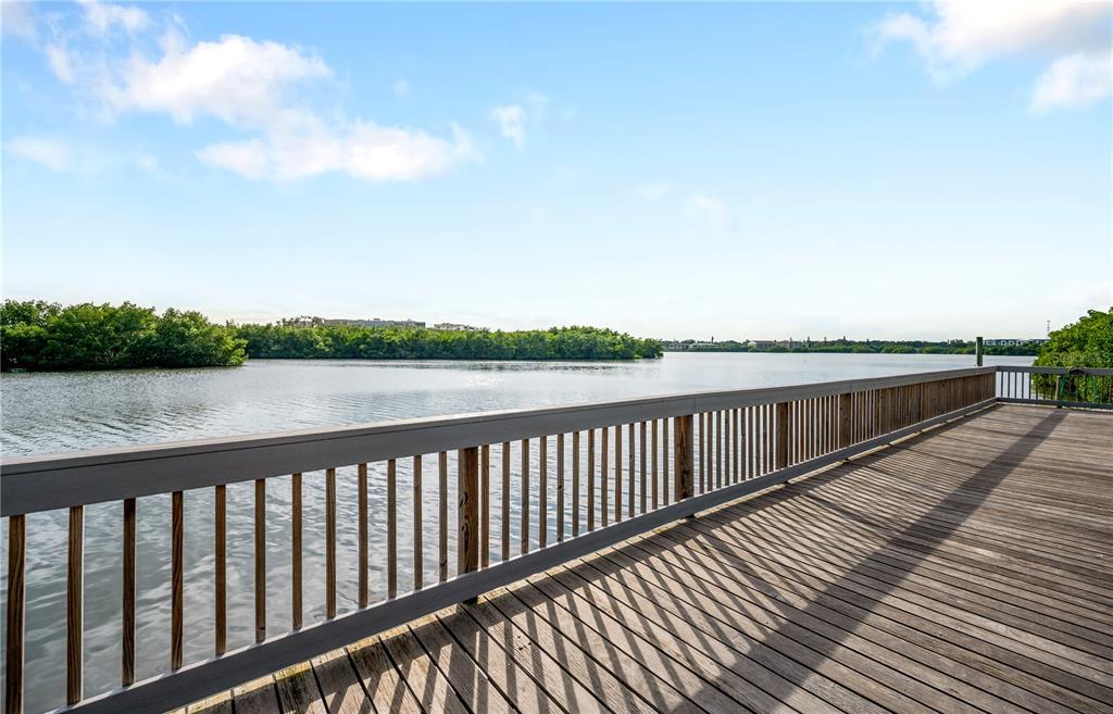 9992 Key Haven Road Seminole, FL 33777 - Photo 47 of 49 a balcony with wooden floor and lake view