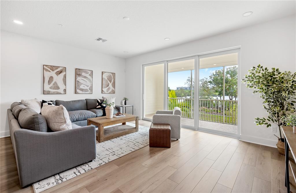 9992 Key Haven Road Seminole, FL 33777 - Photo 8 of 49 a living room with furniture and a large window