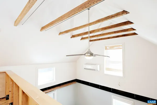 a view of a room with rack and wooden floor