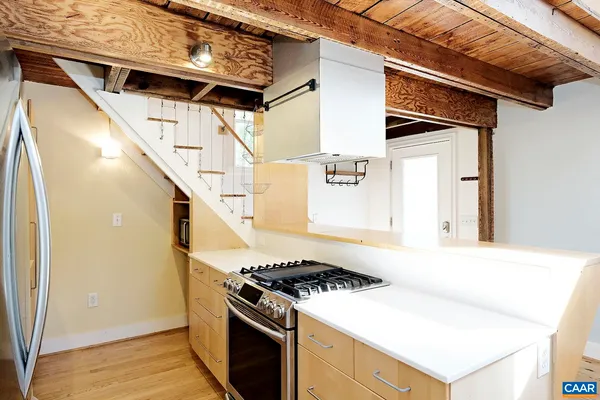 a kitchen with a stove and a microwave