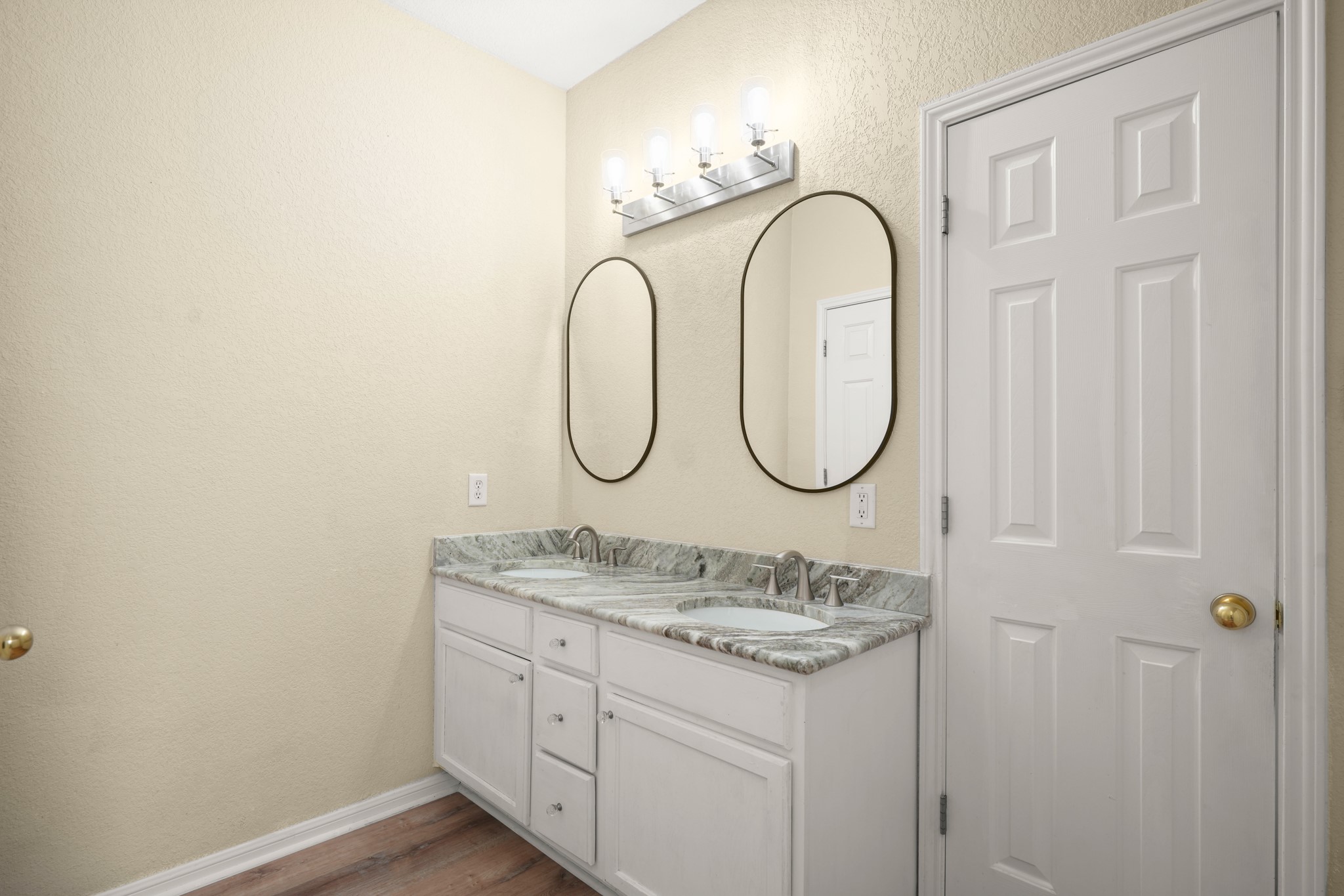 438 Katy Crossing Georgetown, TX 78626 - Photo 16 of 24 Double vanity with sleek mirrors and granite counters offers a harmonious start to your day.