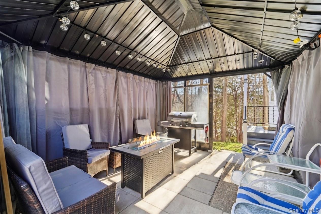 154 Old State Road Highland Falls, NY 10928 - Photo 40 of 49 Covered patio with seating and fire table.