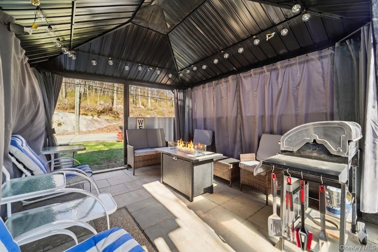 154 Old State Road Highland Falls, NY 10928 - Photo 41 of 49 Covered patio with seating and fire table.