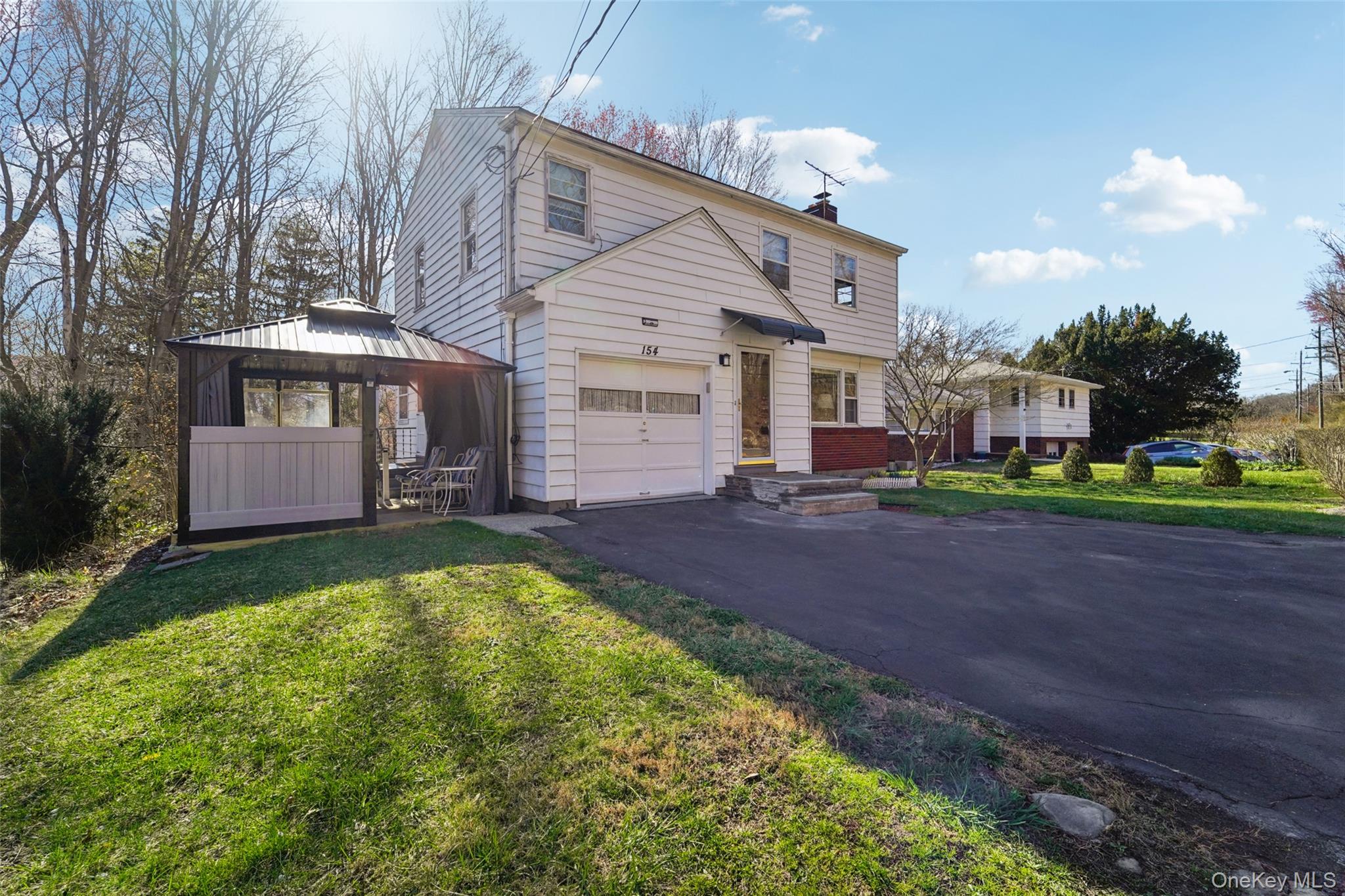154 Old State Road Highland Falls, NY 10928 - Photo 42 of 49 Front of home showing driveway, garage, and covered patio.