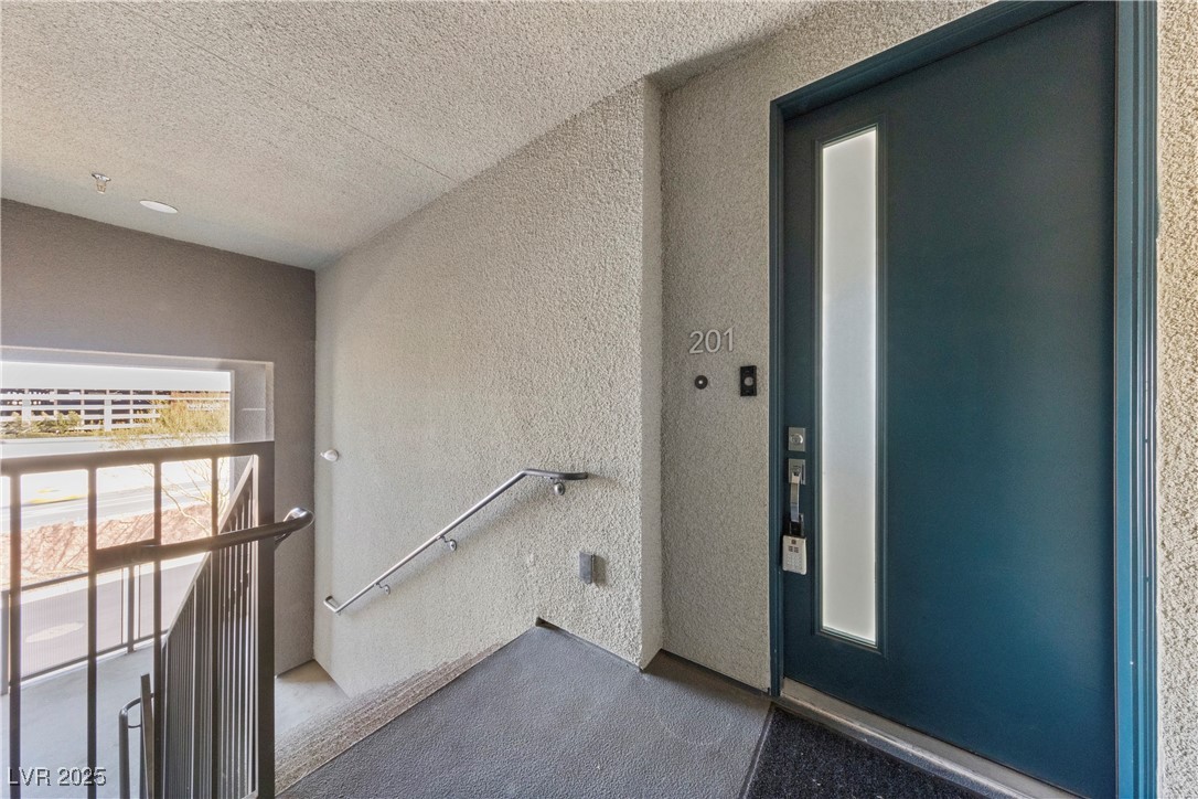 11238 Essence Point Avenue, Unit 201 Las Vegas, NV 89135 - Photo 11 of 52 Property entrance with elevator