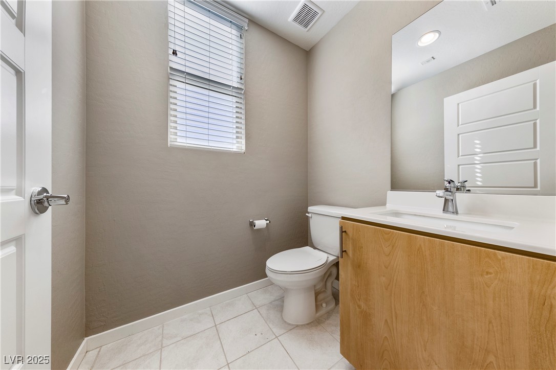 11238 Essence Point Avenue, Unit 201 Las Vegas, NV 89135 - Photo 15 of 52 Bathroom featuring vanity and light tile patterned flooring
