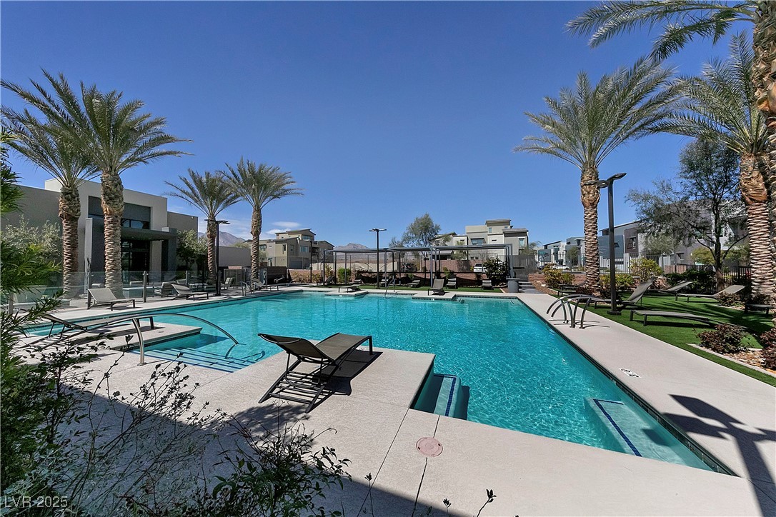 11238 Essence Point Avenue, Unit 201 Las Vegas, NV 89135 - Photo 29 of 52 Community pool with a patio area