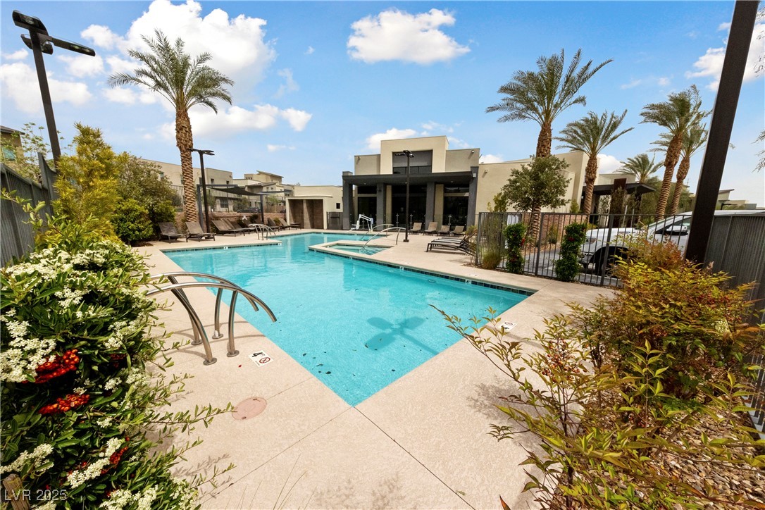 11238 Essence Point Avenue, Unit 201 Las Vegas, NV 89135 - Photo 32 of 52 Community pool with a patio