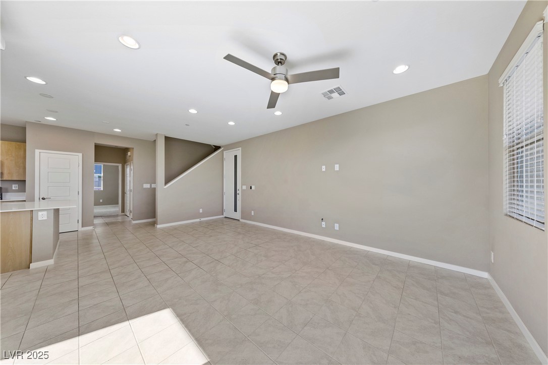 11238 Essence Point Avenue, Unit 201 Las Vegas, NV 89135 - Photo 10 of 52 Empty room featuring ceiling fan, light tile patterned flooring, and recessed lighting