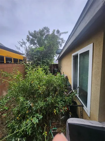 a view of a backyard with sitting area