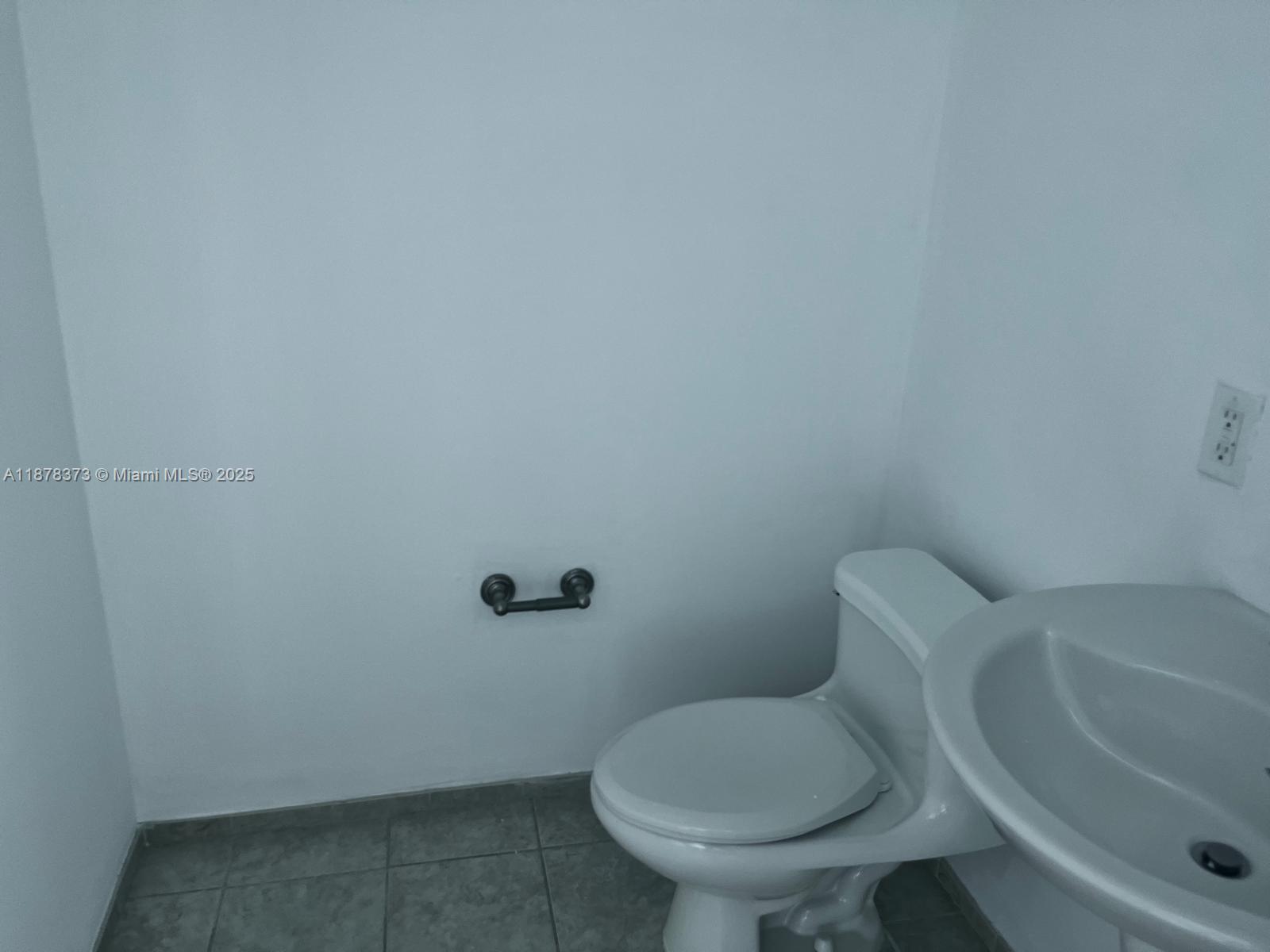 60 Southwest 13th Street, Unit 1417 Miami, FL 33130 - Photo 6 of 9 a white toilet sitting next to a white sink