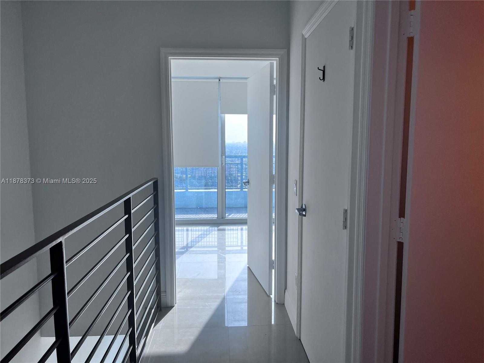 60 Southwest 13th Street, Unit 1417 Miami, FL 33130 - Photo 7 of 9 a view of hallway with wooden floor