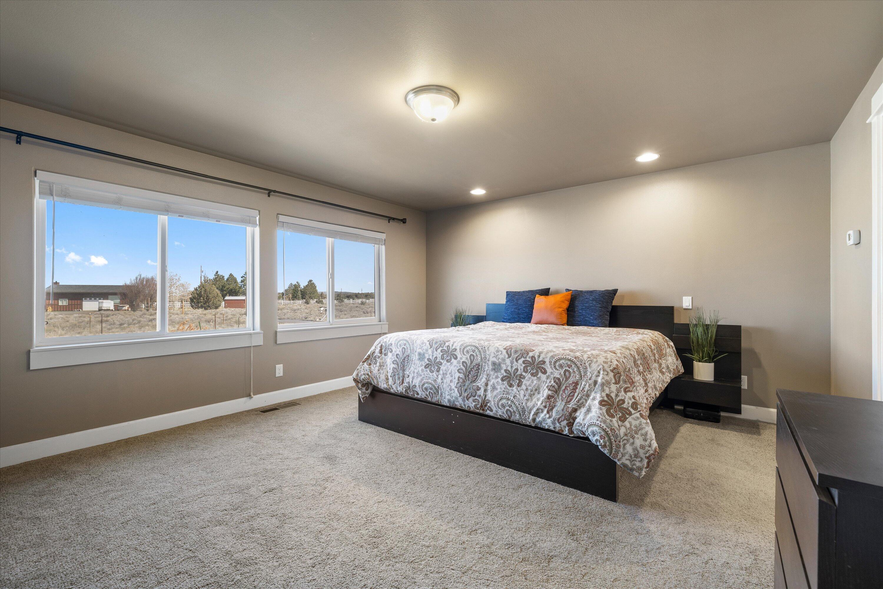 17518 Plainview Road Bend, OR 97703 - Photo 17 of 35 The main primary bedroom has loads of natural light.