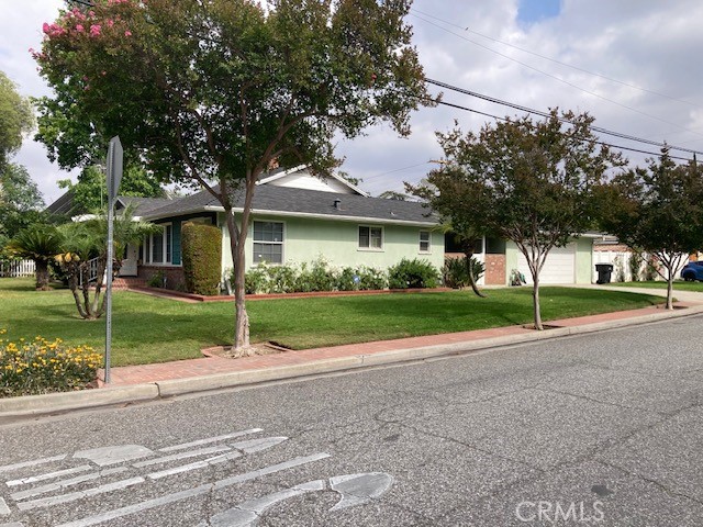 4948 Granada Avenue Riverside, CA 92504 - Photo 2 of 33 a view of a house with a yard and large trees