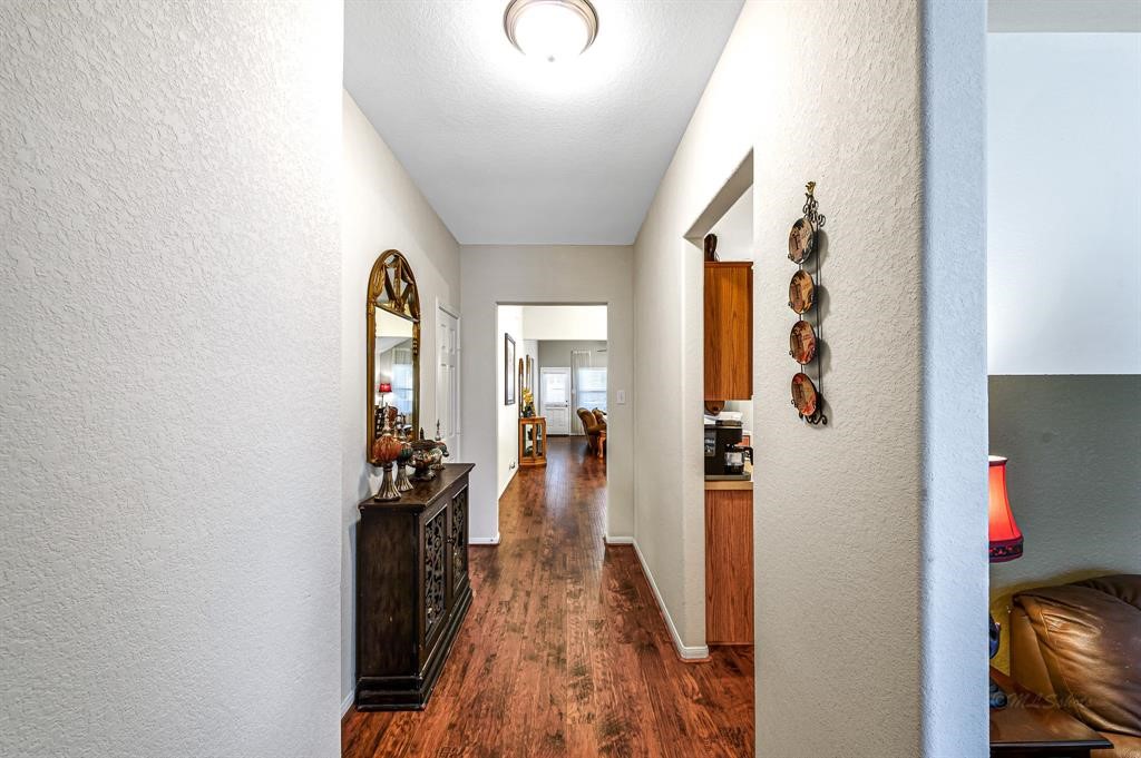 3203 Dale Ridge Trail Houston, TX 77084 - Photo 5 of 33 Bright entryway hallway featuring warm flooring leading directly into the main living spaces.