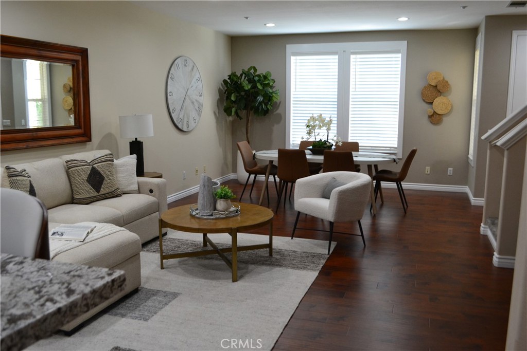 18 Corbin Street Ladera Ranch, CA 92694 - Photo 1 of 1 a living room with furniture and a large window