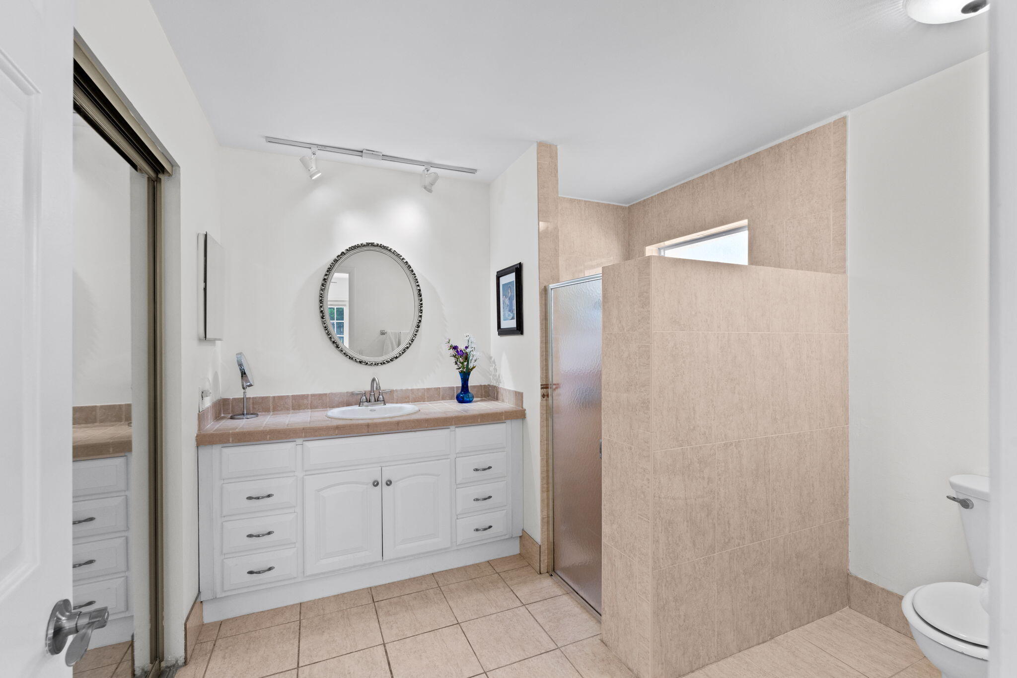 240 Sulky Way Wellington, FL 33414 - Photo 11 of 26 a bathroom with a granite countertop sink mirror vanity and a toilet
