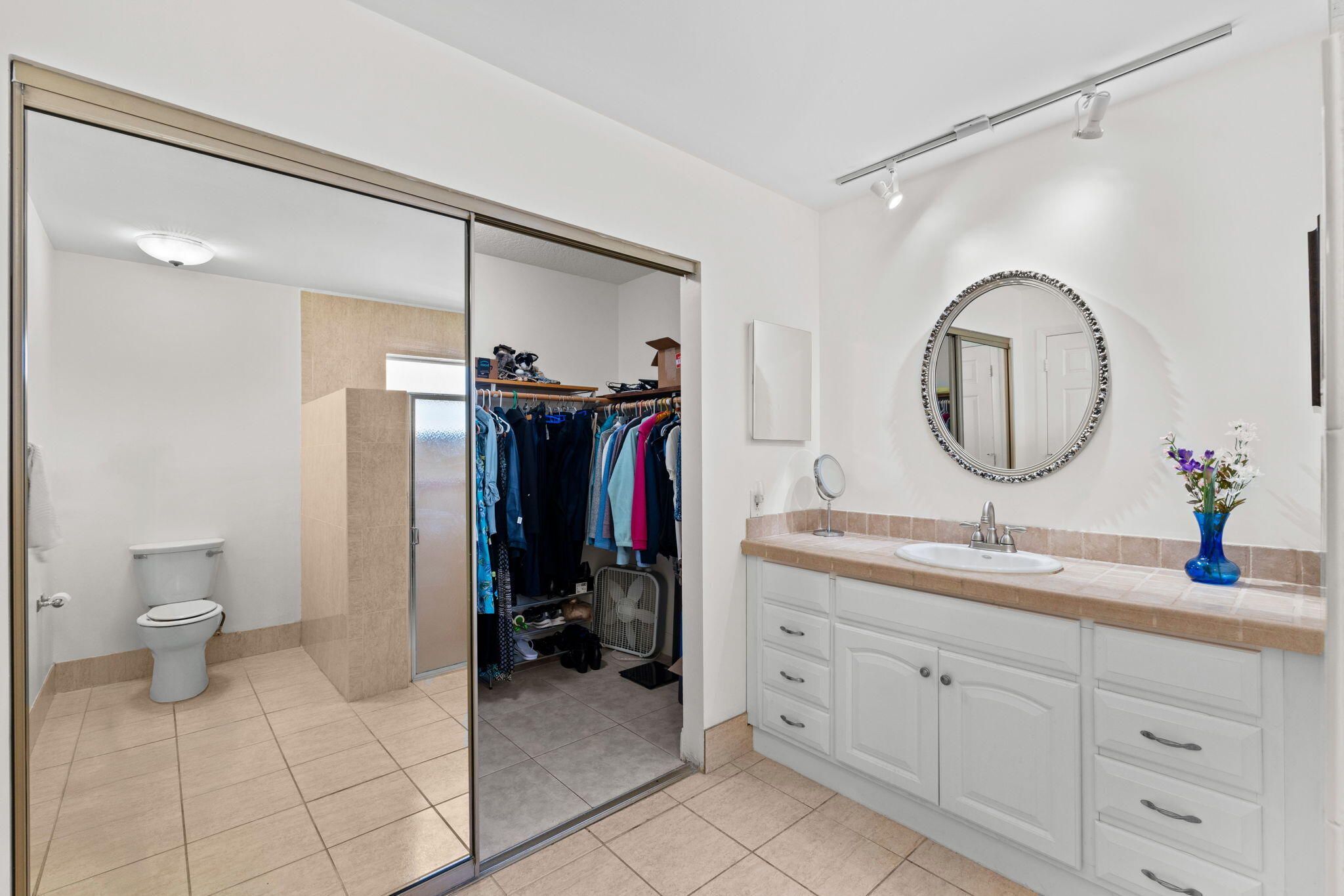 240 Sulky Way Wellington, FL 33414 - Photo 12 of 26 a spacious bathroom with a granite countertop sink and a mirror