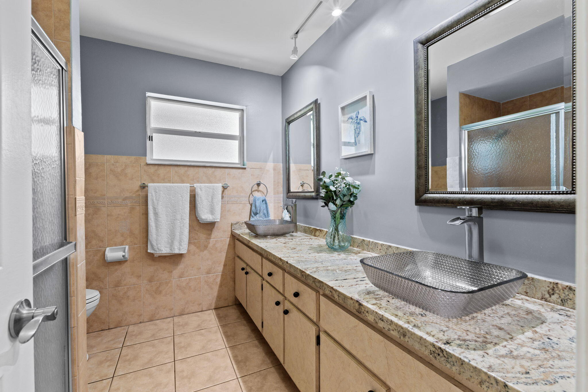 240 Sulky Way Wellington, FL 33414 - Photo 13 of 26 a bathroom with a granite countertop sink and a mirror