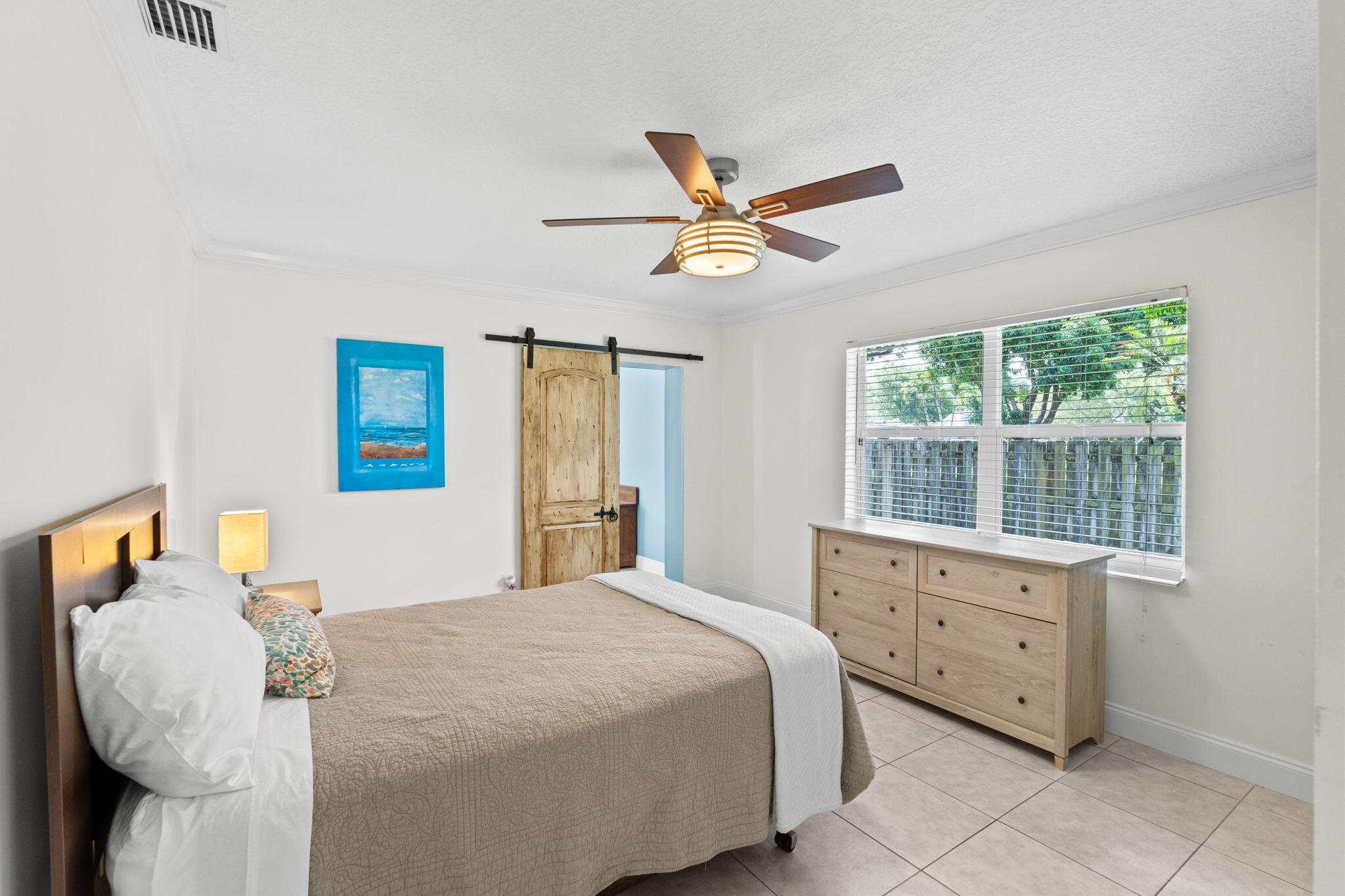 240 Sulky Way Wellington, FL 33414 - Photo 15 of 26 a bedroom with a bed and a window