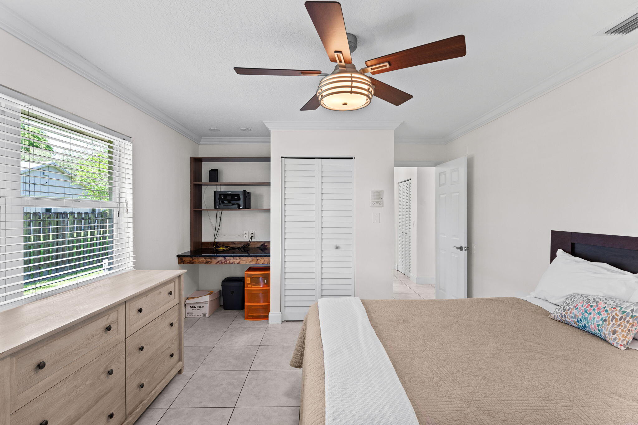 240 Sulky Way Wellington, FL 33414 - Photo 16 of 26 a bedroom with a bed and a chandelier