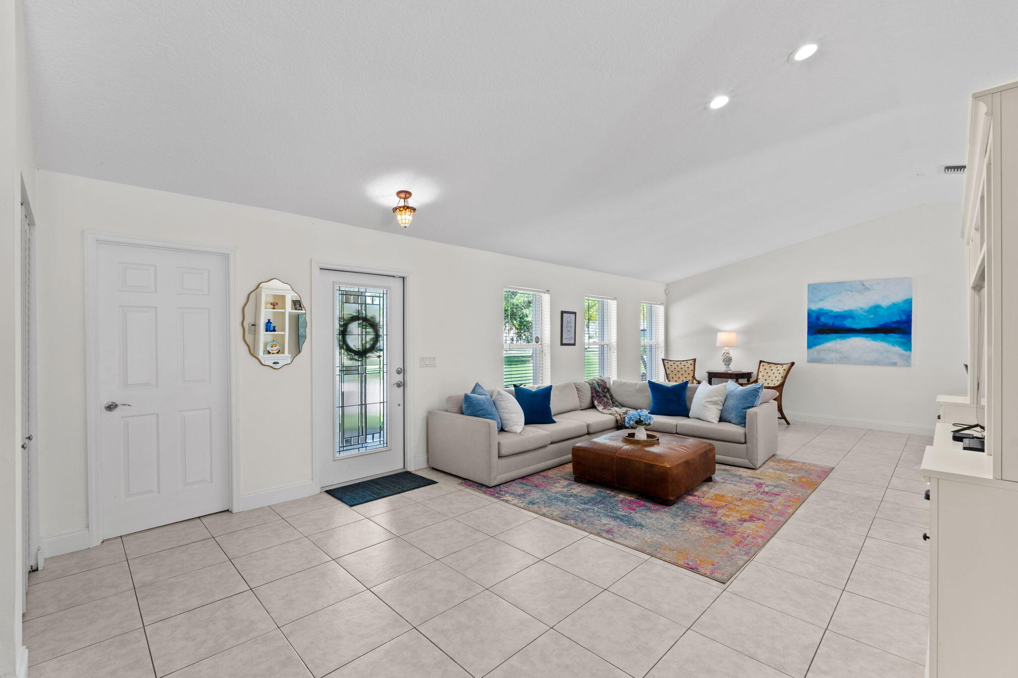 240 Sulky Way Wellington, FL 33414 - Photo 3 of 26 a living room with furniture and a table