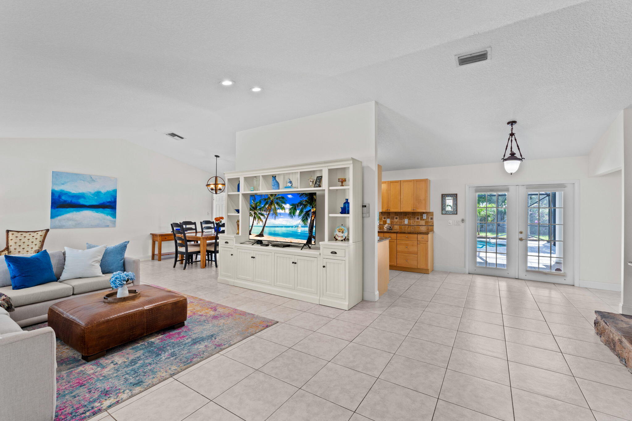 240 Sulky Way Wellington, FL 33414 - Photo 4 of 26 a living room with furniture and a flat screen tv