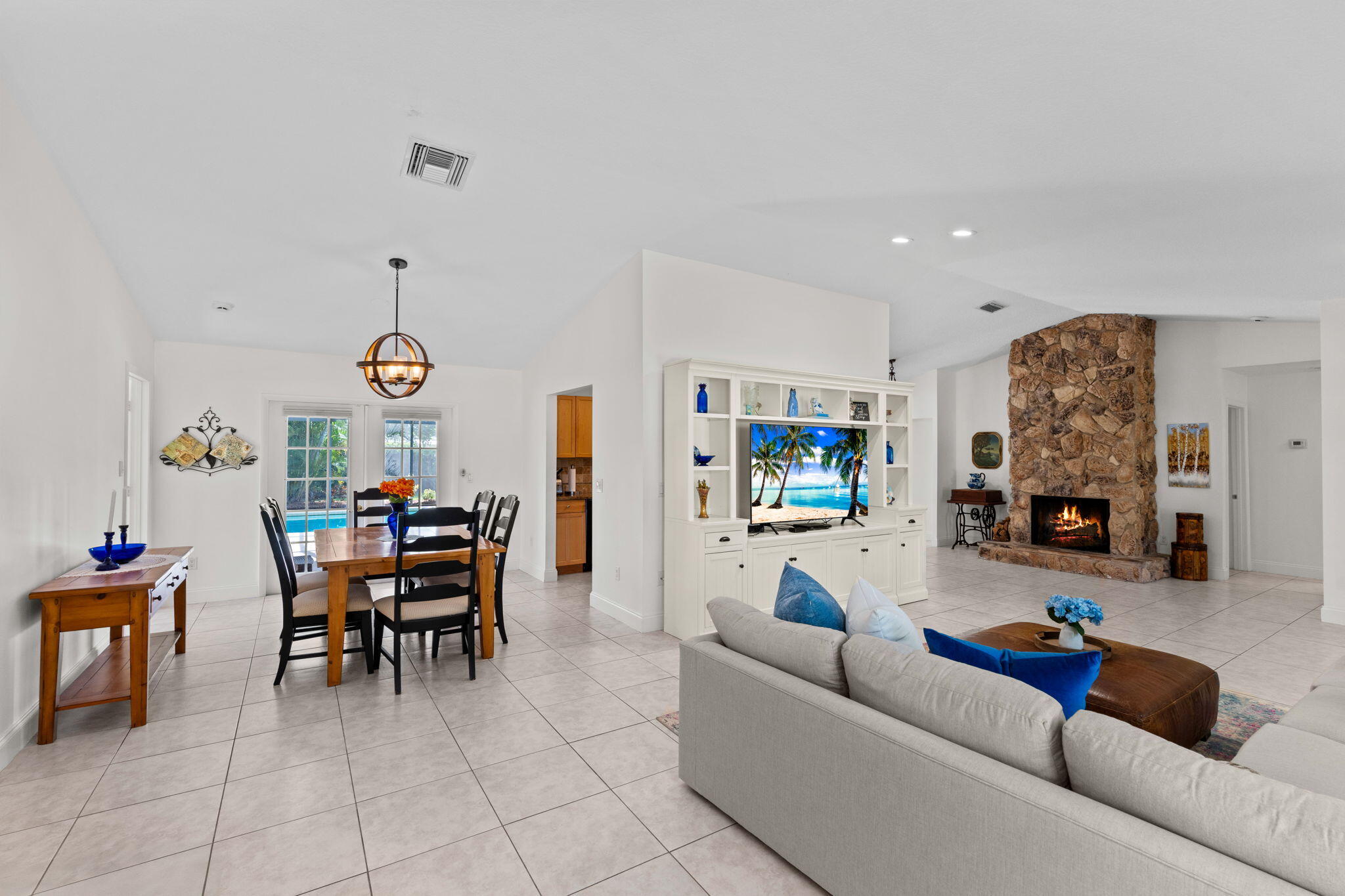 240 Sulky Way Wellington, FL 33414 - Photo 6 of 26 a living room with furniture and a flat screen tv