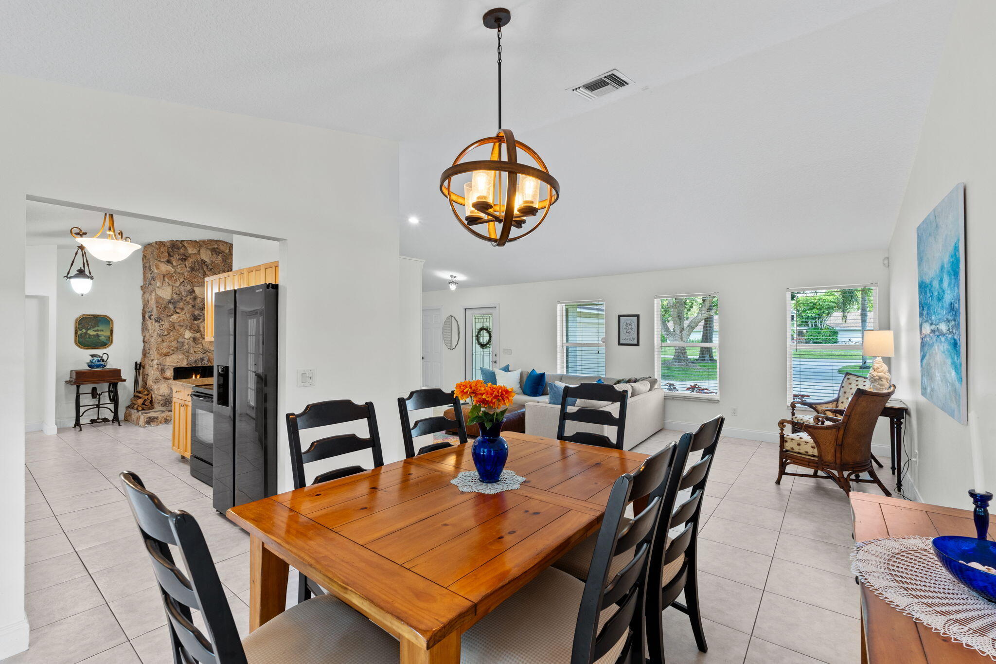 240 Sulky Way Wellington, FL 33414 - Photo 7 of 26 a view of a dining room with furniture window and wooden floor