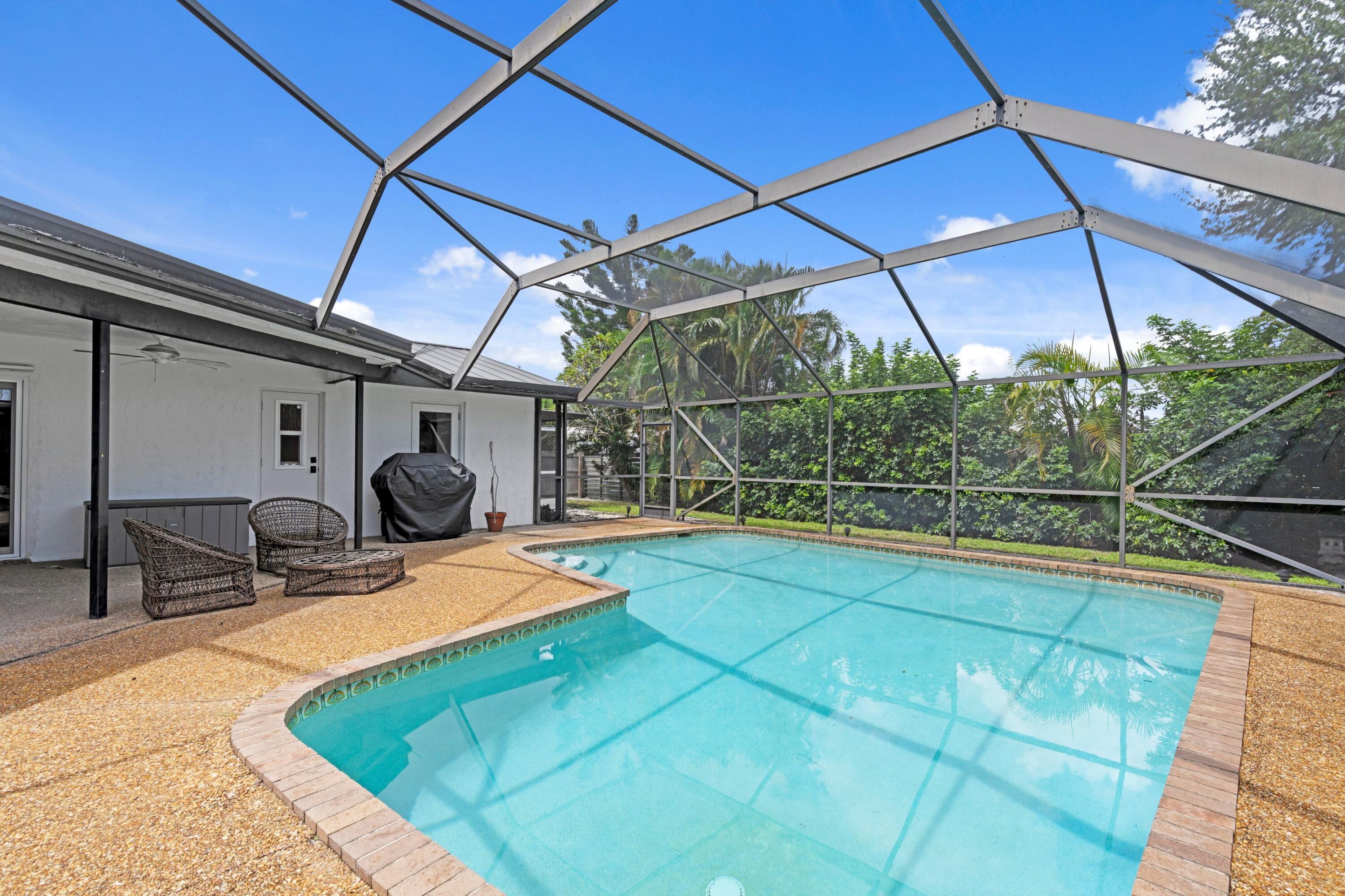 1039 Northwest 8th Street Boca Raton, FL 33486 - Photo 15 of 17 a view of a backyard with sitting area
