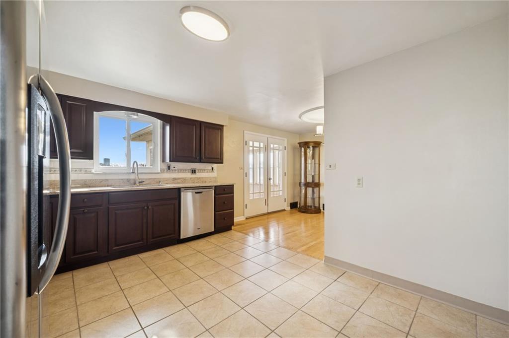 421 Robbins Station Road Irwin, PA 15642 - Photo 12 of 33 a large kitchen with cabinets and stainless steel appliances