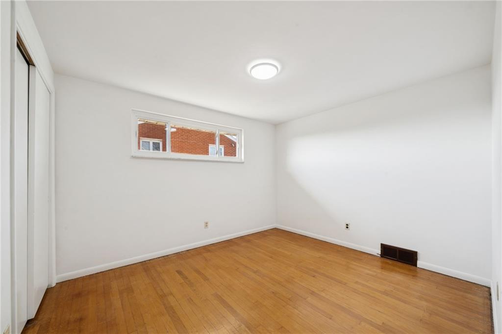 421 Robbins Station Road Irwin, PA 15642 - Photo 20 of 33 a view of empty room with wooden floor