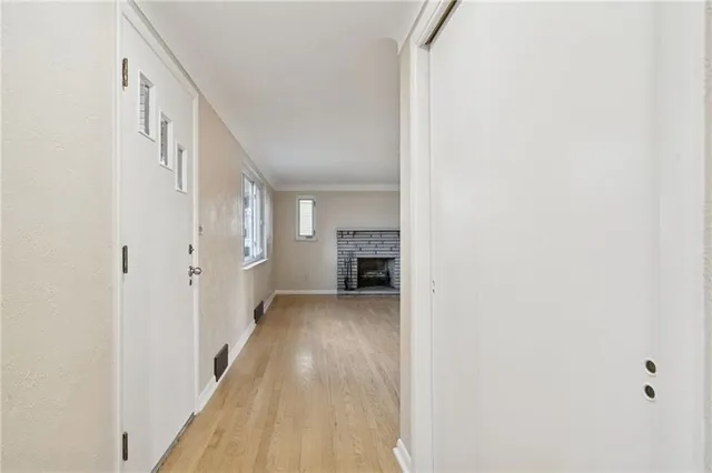 a view of a room with wooden walls