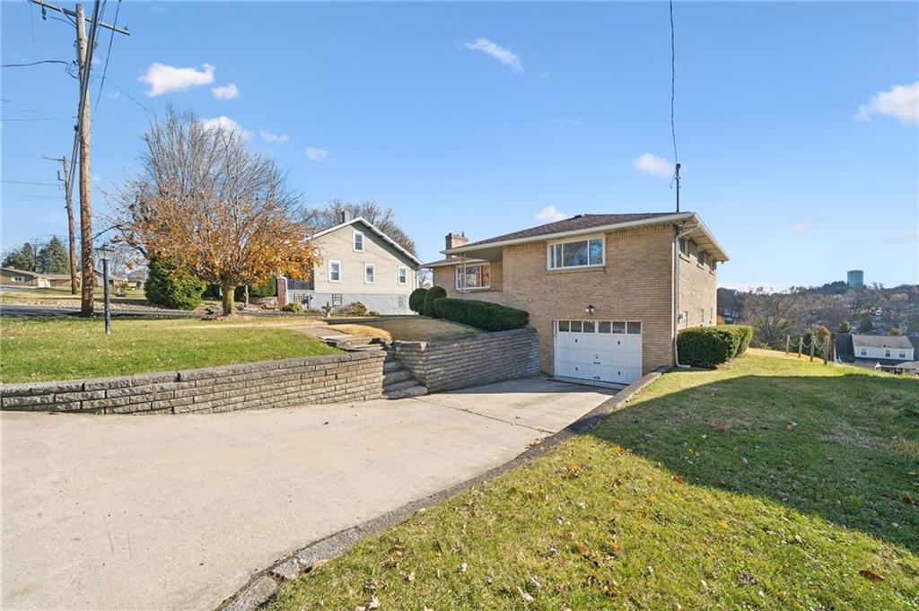 421 Robbins Station Road Irwin, PA 15642 - Photo 33 of 33 a view of a house with a yard