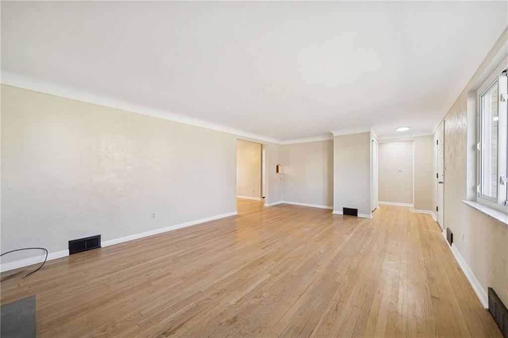 421 Robbins Station Road Irwin, PA 15642 - Photo 5 of 33 a view of an empty room with wooden floor