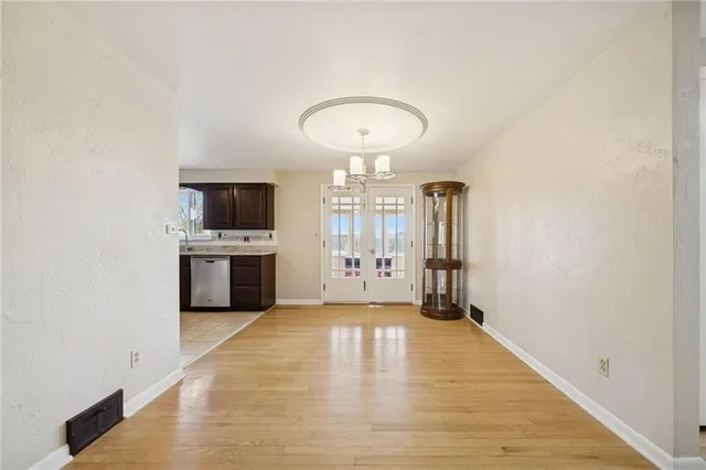 a view of a kitchen with a sink and cabinets