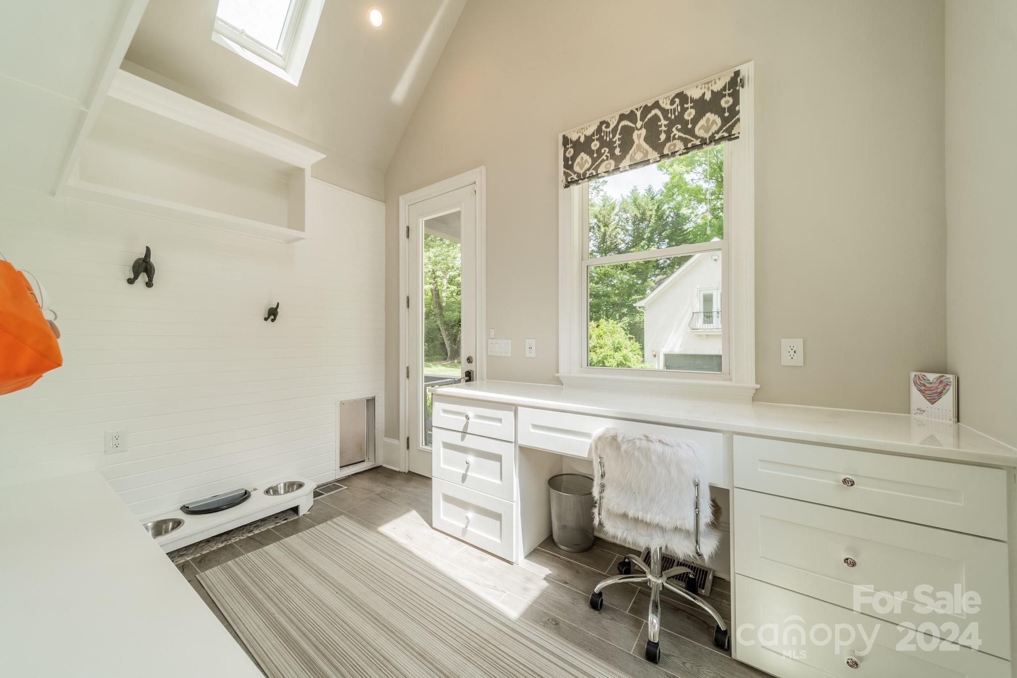 3701 Barclay Downs Drive Charlotte, NC 28209 - Photo 36 of 47 a view of a workspace with furniture and a window
