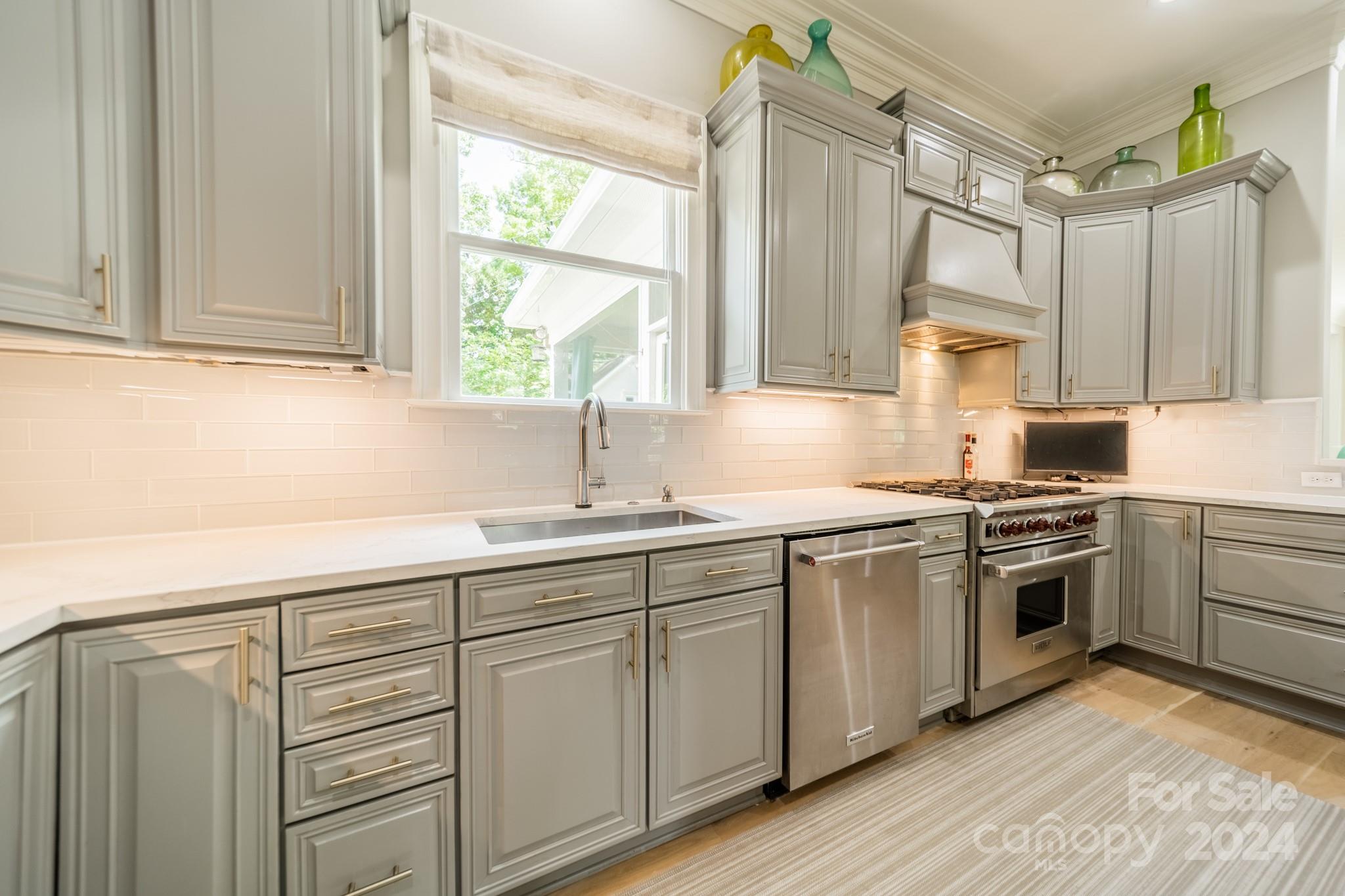 3701 Barclay Downs Drive Charlotte, NC 28209 - Photo 8 of 47 a kitchen with white cabinets and white appliances
