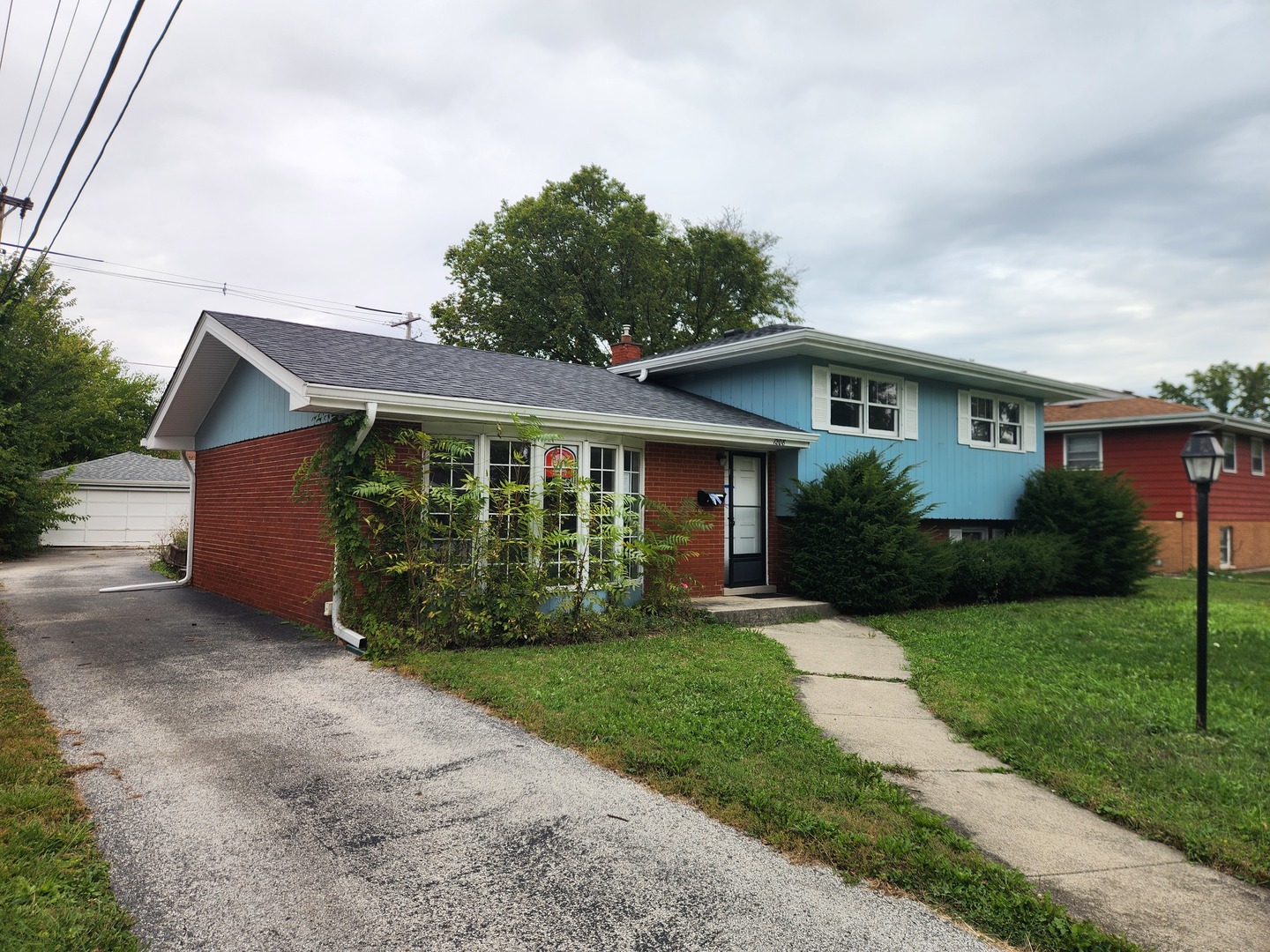 1208 Evergreen Road Homewood, IL 60430 - Photo 2 of 12 a front view of a house with a yard
