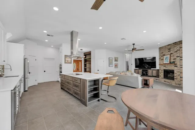 a kitchen with a table and chairs in it