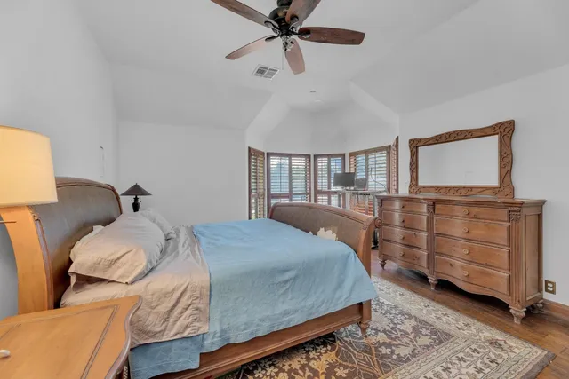 a bedroom with a bed and furniture