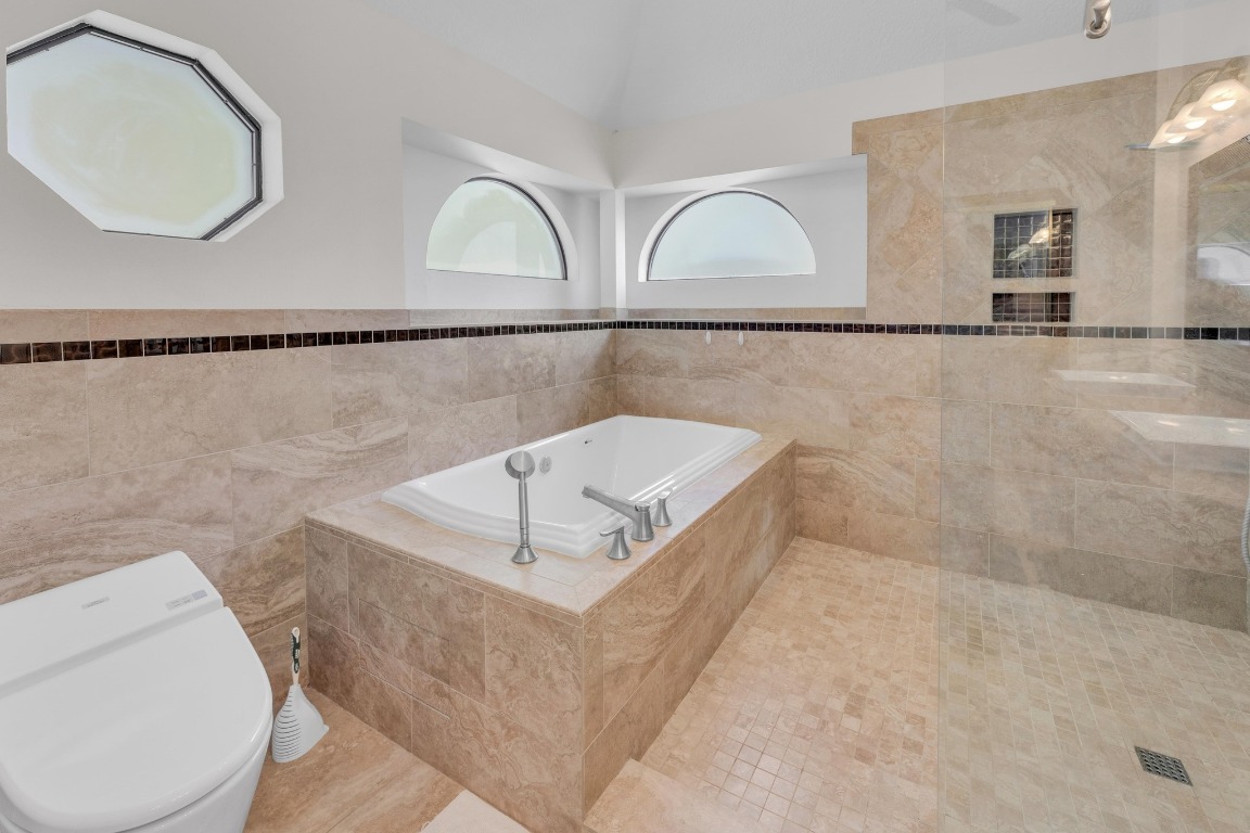 2 Meandering Way Round Rock, TX 78664 - Photo 25 of 39 a bathroom with a sink a toilet and mirror