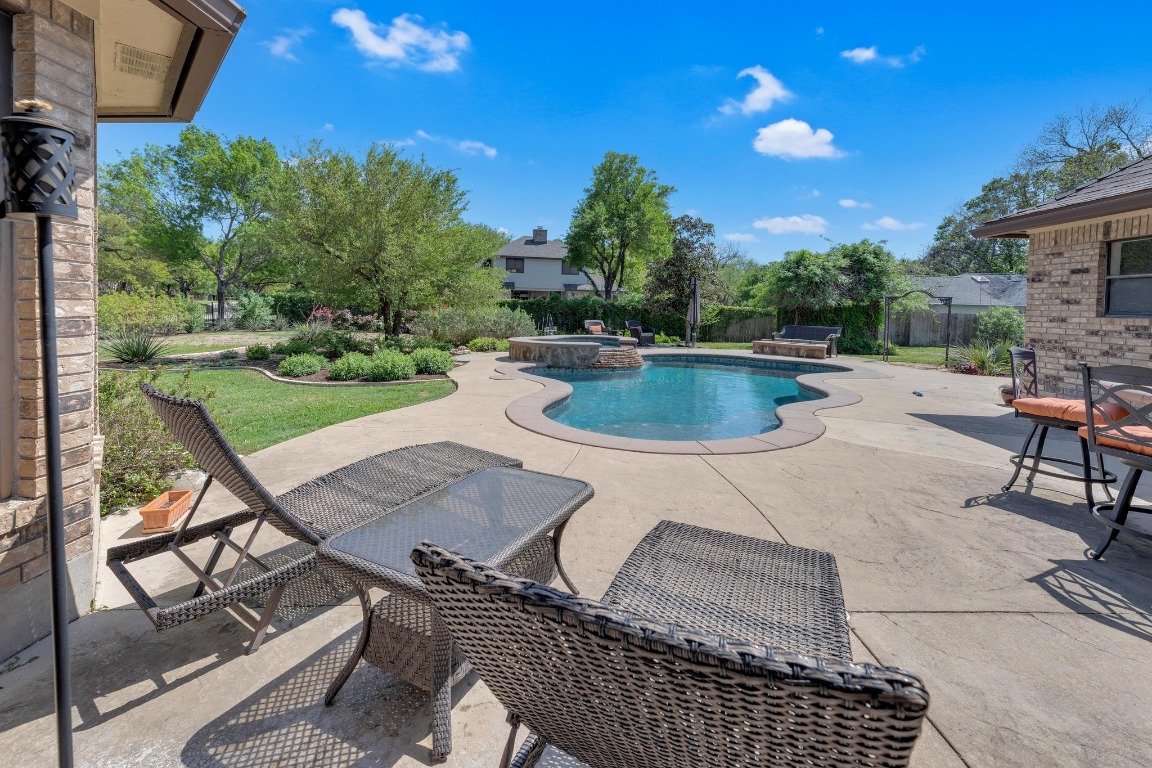 2 Meandering Way Round Rock, TX 78664 - Photo 35 of 39 a view of a backyard with sitting area