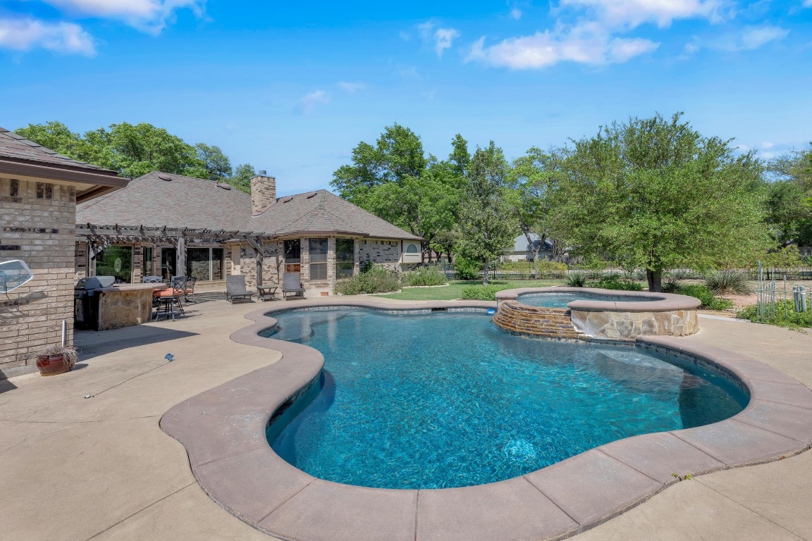 2 Meandering Way Round Rock, TX 78664 - Photo 36 of 39 a view of a house with swimming pool and sitting area