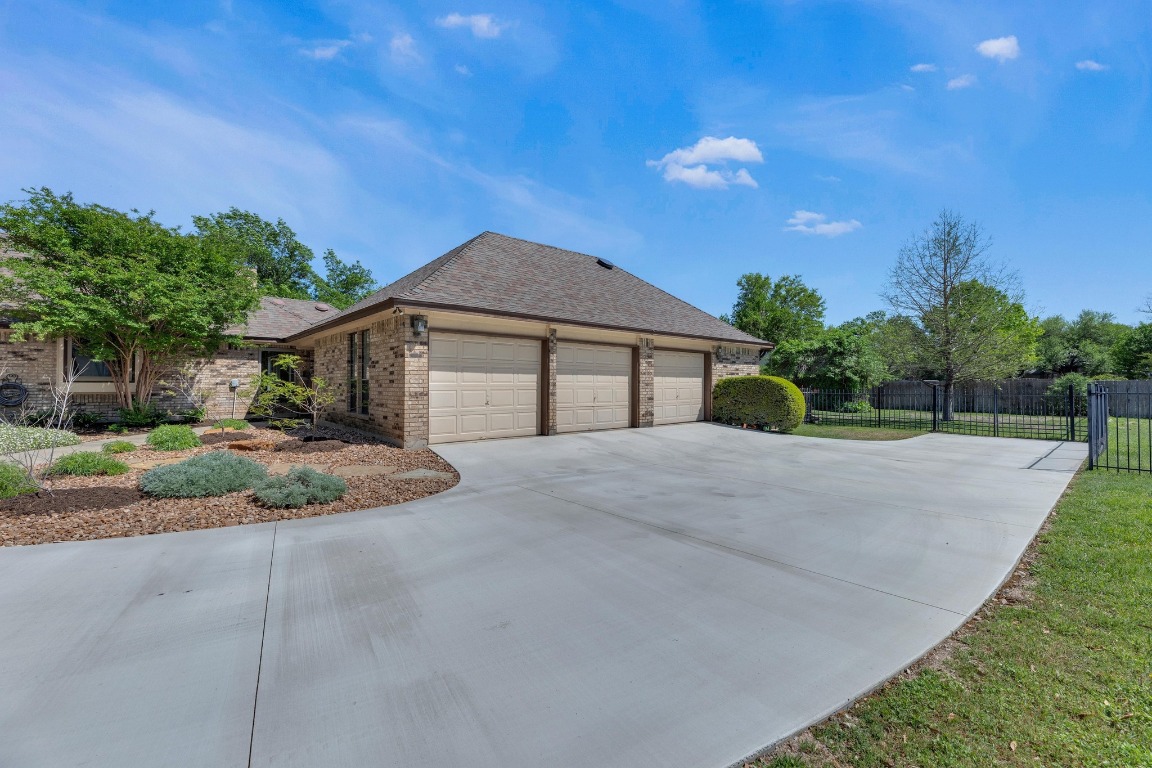 2 Meandering Way Round Rock, TX 78664 - Photo 6 of 39 a front view of a house with a yard and potted plants